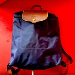 Beautiful purple small Longchamp backpack in great condition.